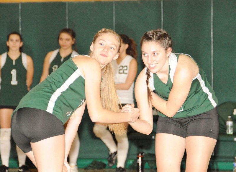 Seniors Bre Soutar and Natalie Gilfus celebrate during a recent game.