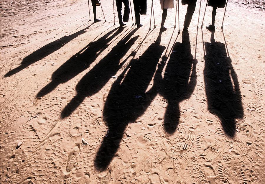 Shadows of land mine victims, Luena, Angola.