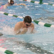 John Christopher swims the second leg of the 200 Medley Relay (Jared Sullivan)