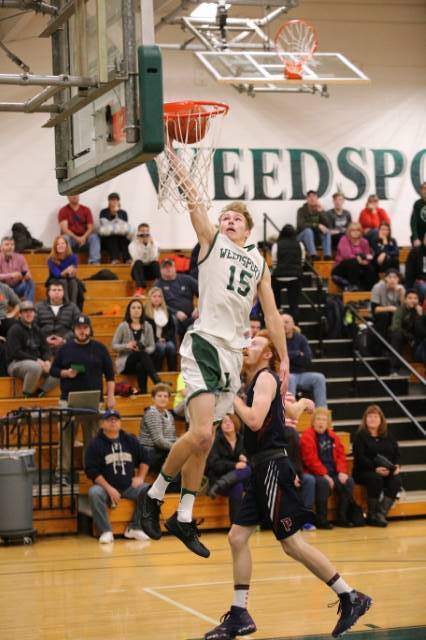 Riley Spingler goes up for a basket in a game last season.