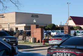 Police set a perimeter at the West Freeway Church of Christ in White Settlement Texas.