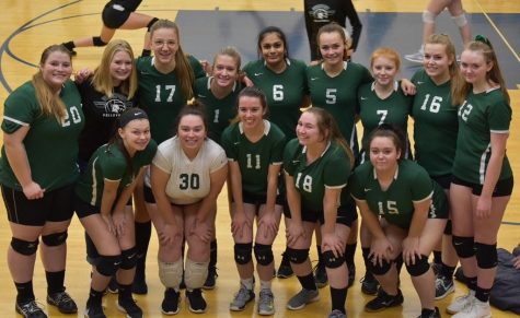 Anna Provoost (top row, third from left) poses with her teammates at a recent match.